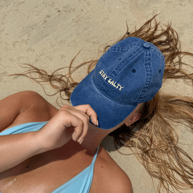 Woman wearing Stay Salty Blue Washed Baseball Cap – 100% Cotton Adjustable Women's Cap Australia